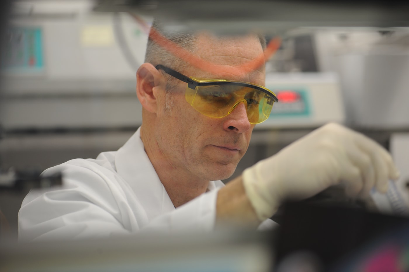 Research scientist in protective laboratory equipment